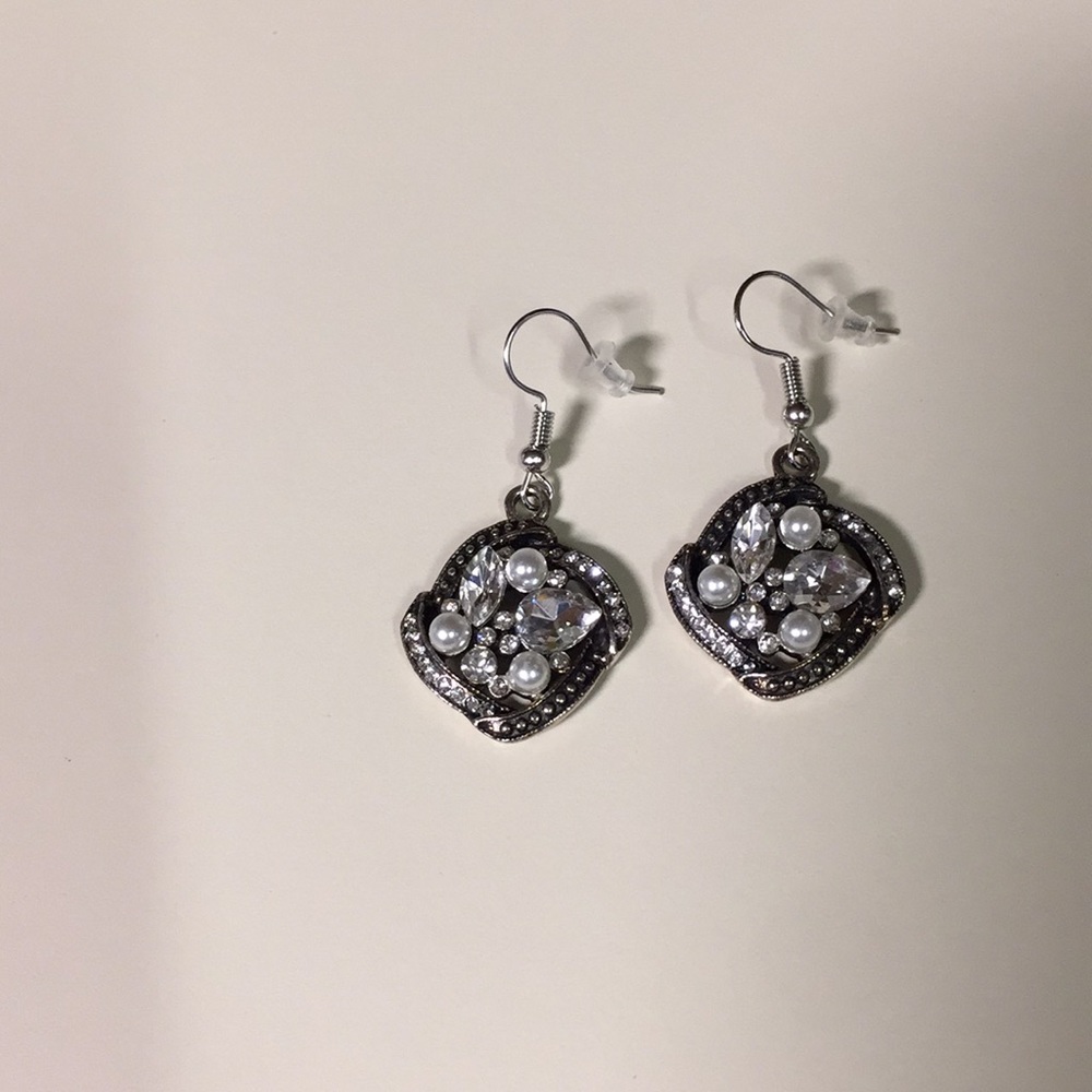 Brand new dangle statement earrings.